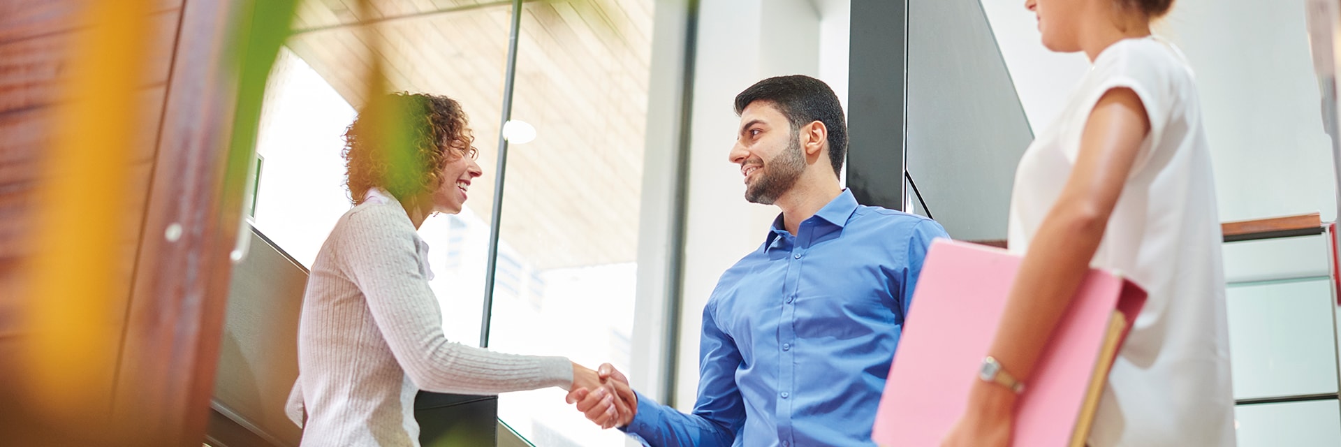 man and woman shaking hands